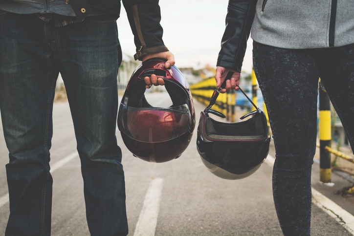 couple-holding-helmets