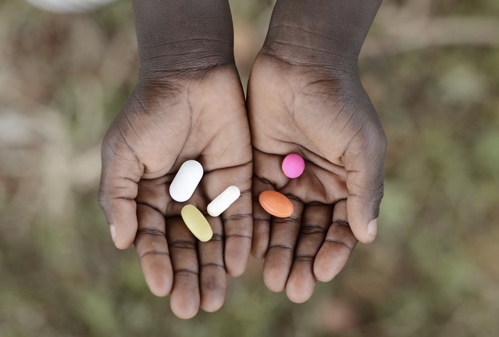girl-holding-pills