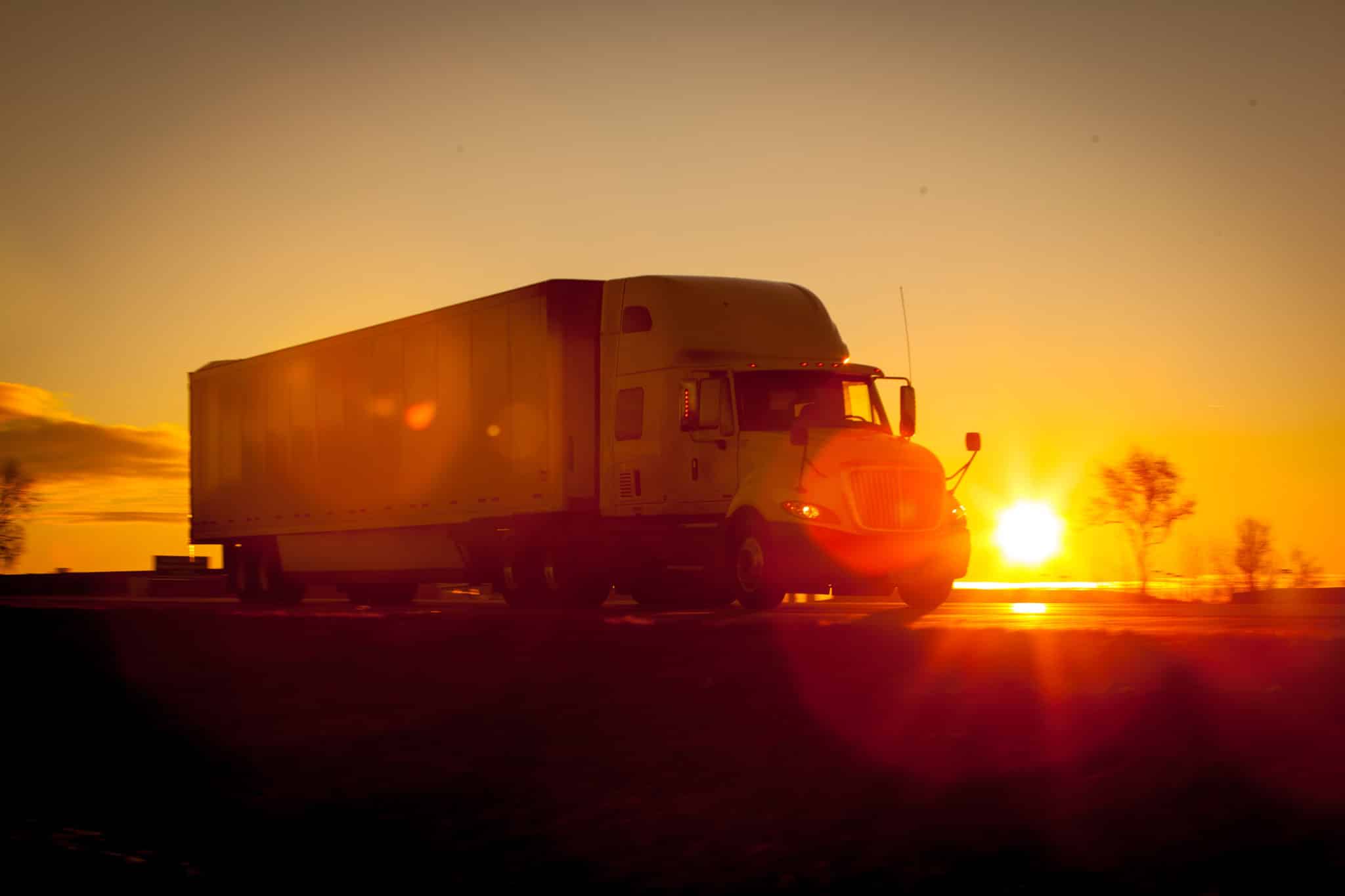 truck-driving-at-sunset