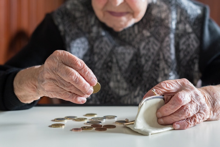 elderly-woman-with-coins