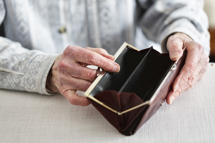 senior-holding-wallet