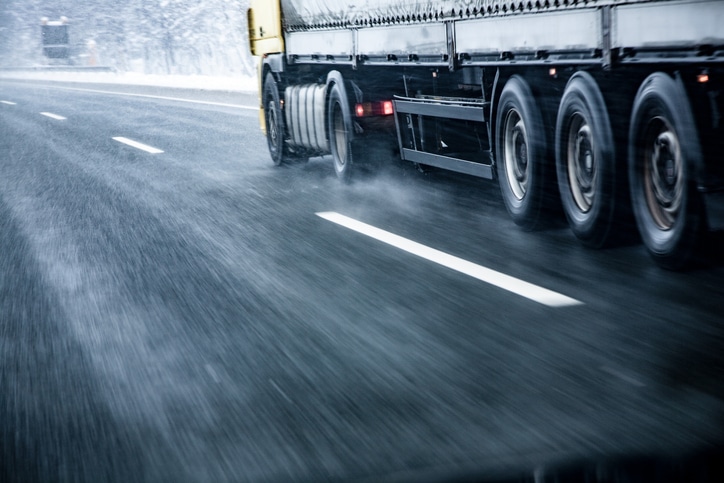 semi-truck-on-wet-road