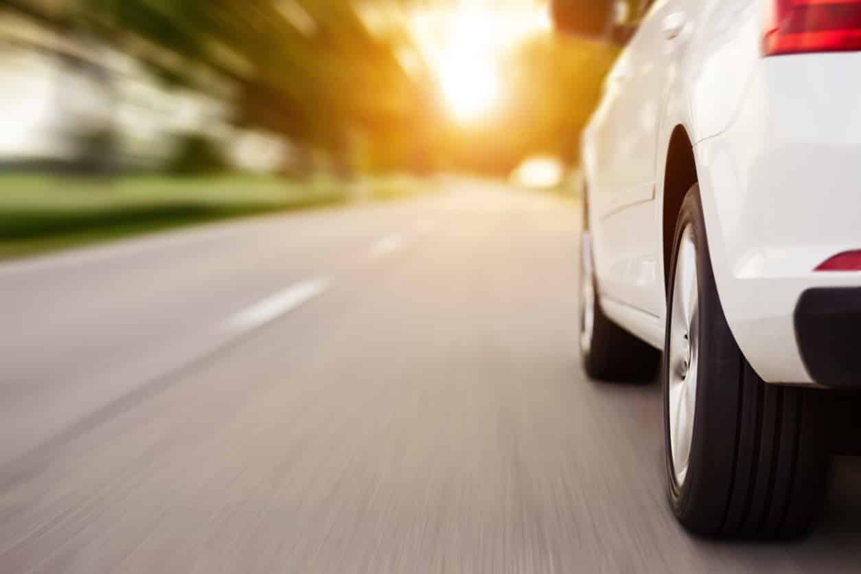 car driving down the road at a low angle