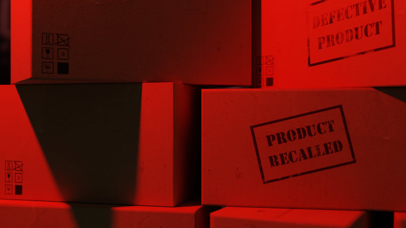 Close up of a pile of cardboard boxes. They have been stamped